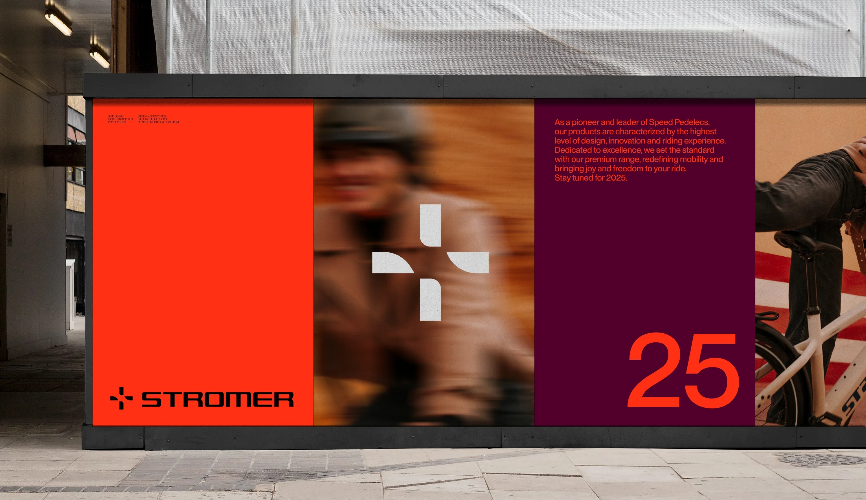 A street billboard showing the Stromer brand identity — a red panel with the logo, a blurred rider, and a dark red panel with the number 25.